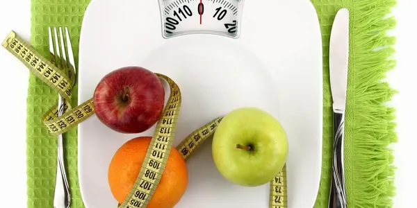 Weight Scale with apples and silverware